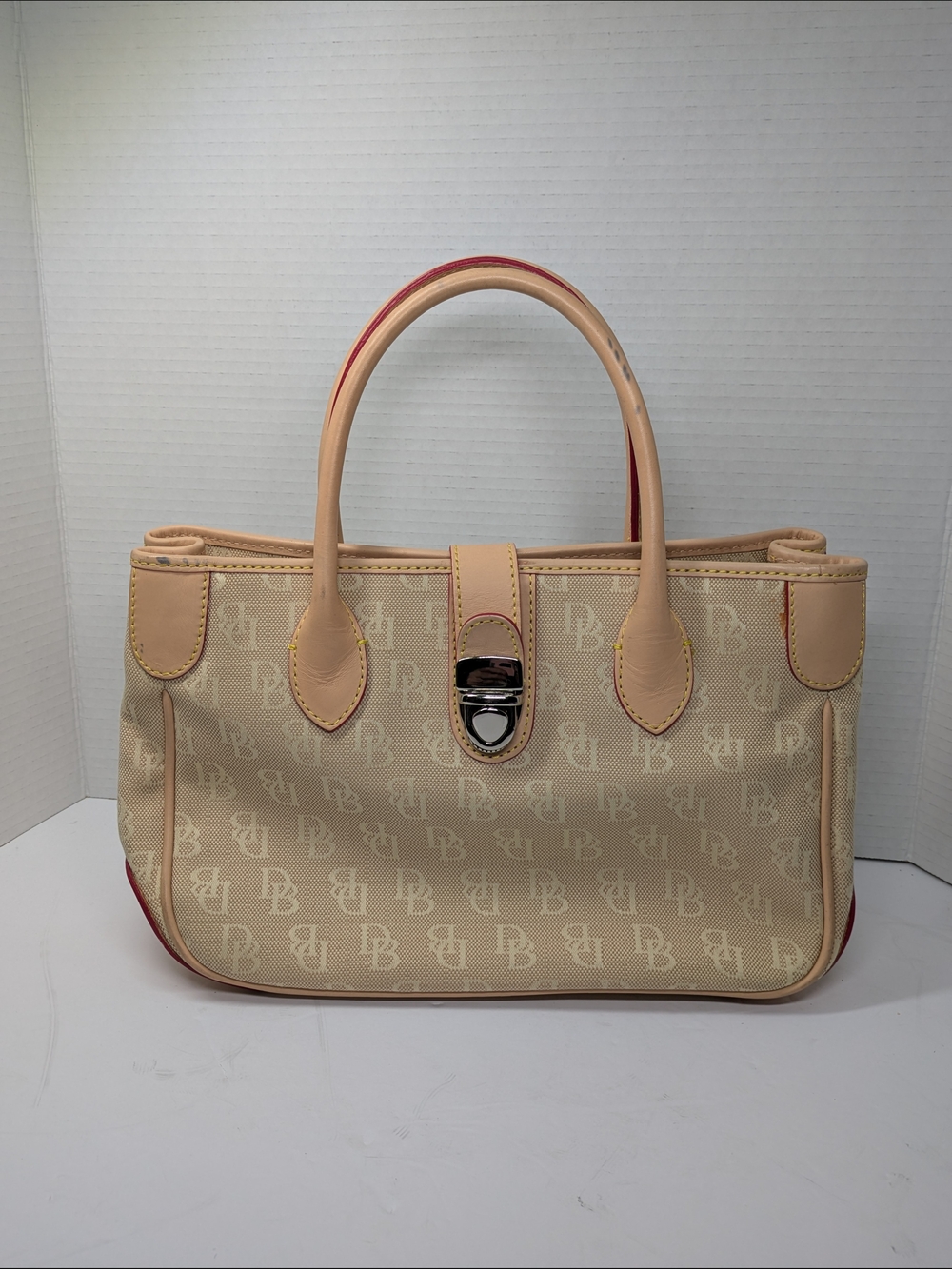 Dooney & Bourke Beige Monogram Tote with Tan Trim and Red Piping
